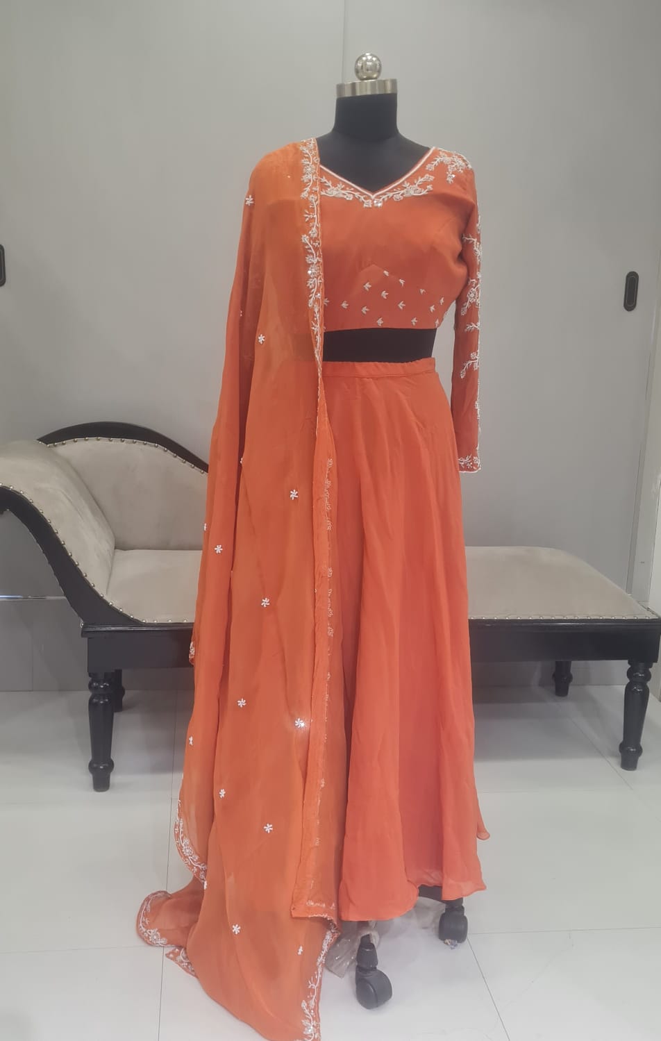 ORANGE WITH WHITE WORK ON LEHENGA CHOLI